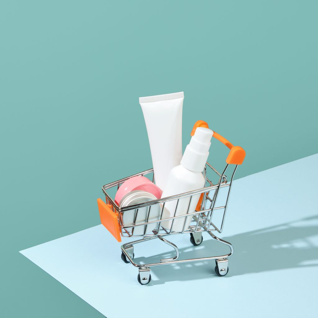 Toy cart with cosmetics, buying cosmetic products in the store.